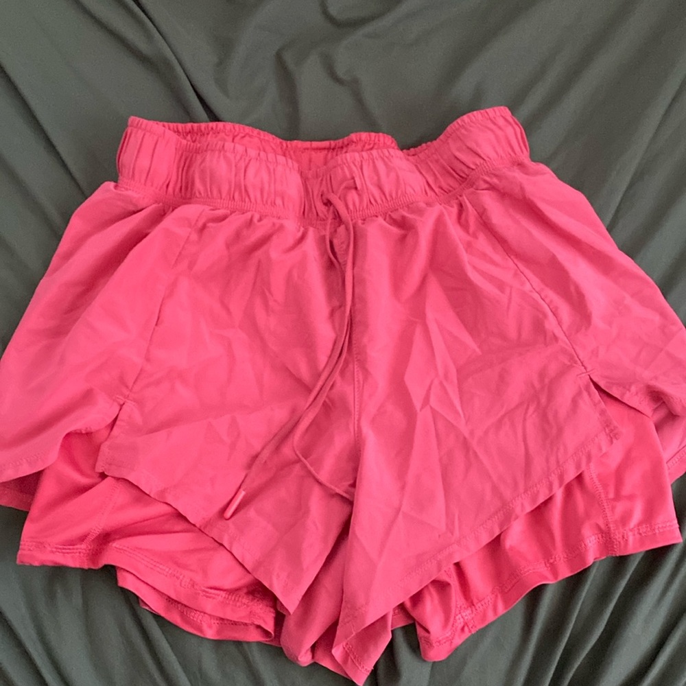 Pink athletic shorts with undershorts